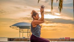woman sitting on yoga mat
