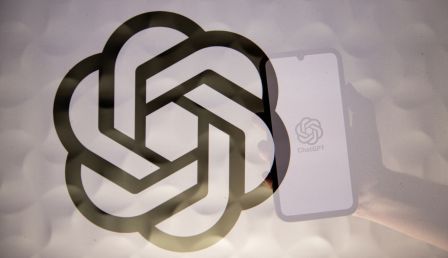 OpenAI logo superimposed on a reflection of a phone