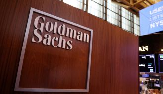 The logo for Goldman Sachs is seen on the trading floor at the New York Stock Exchange (NYSE) in New York City